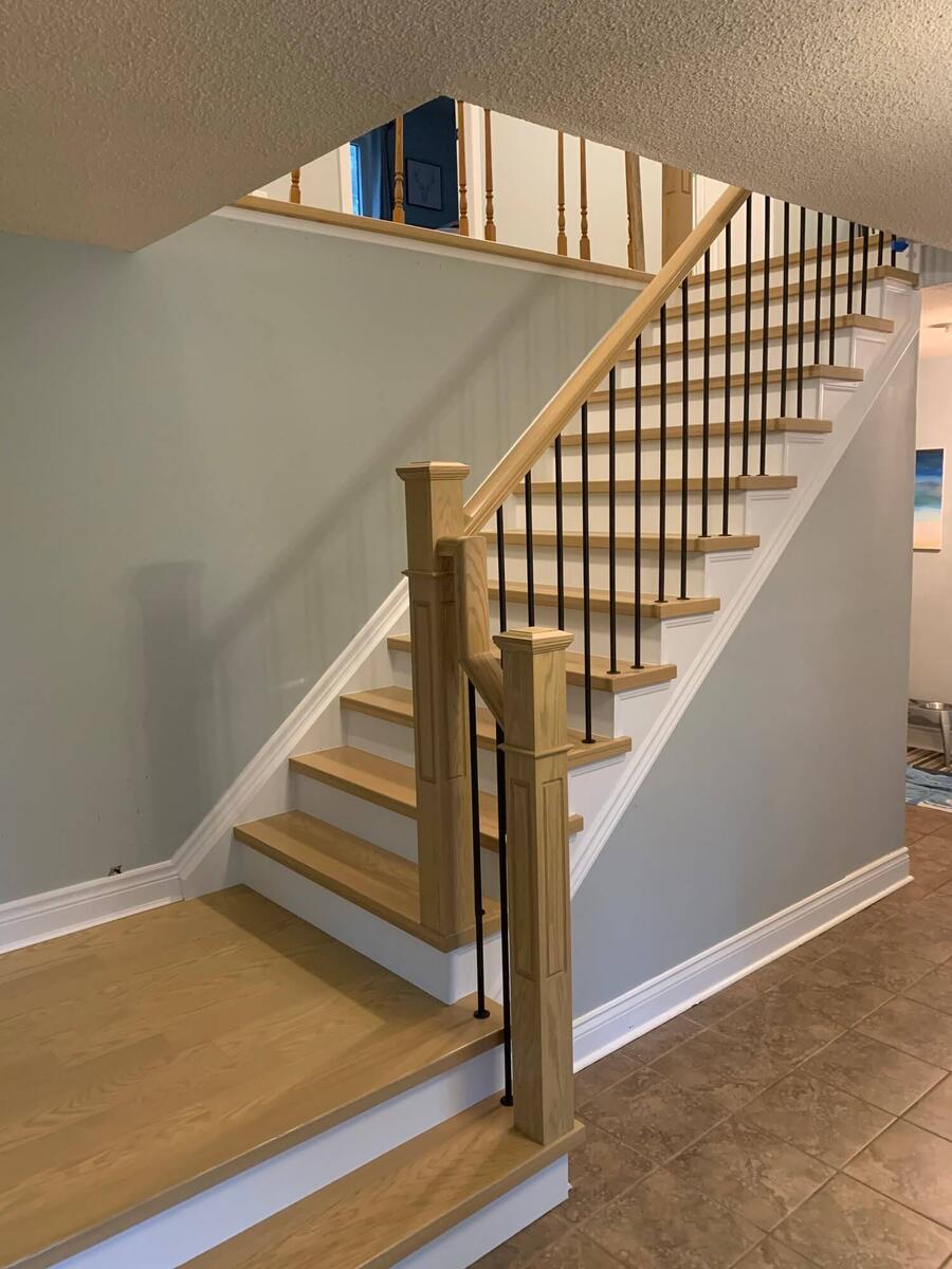 Hardwood staircase with intricate railings