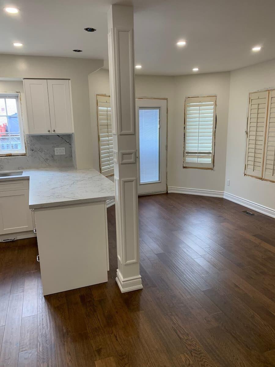 Finished kitchen renovation with modern cabinets, counters, and floors