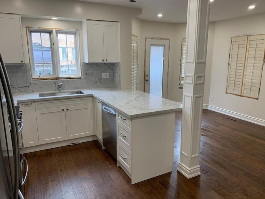 Finished kitchen renovation with modern cabinets, counters, and floors