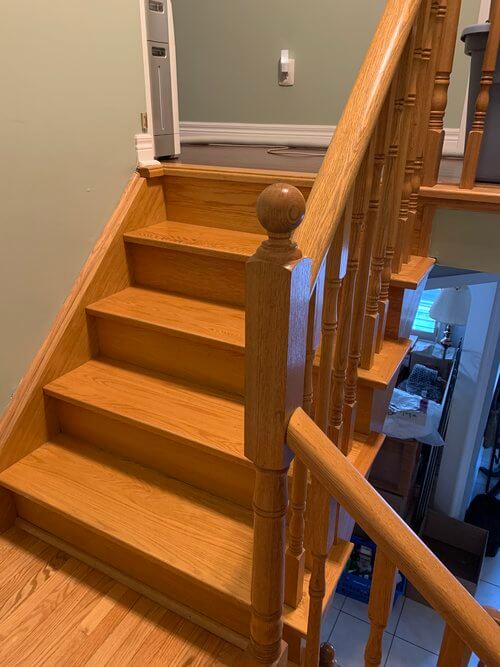 Before photo of tile flooring and staircase