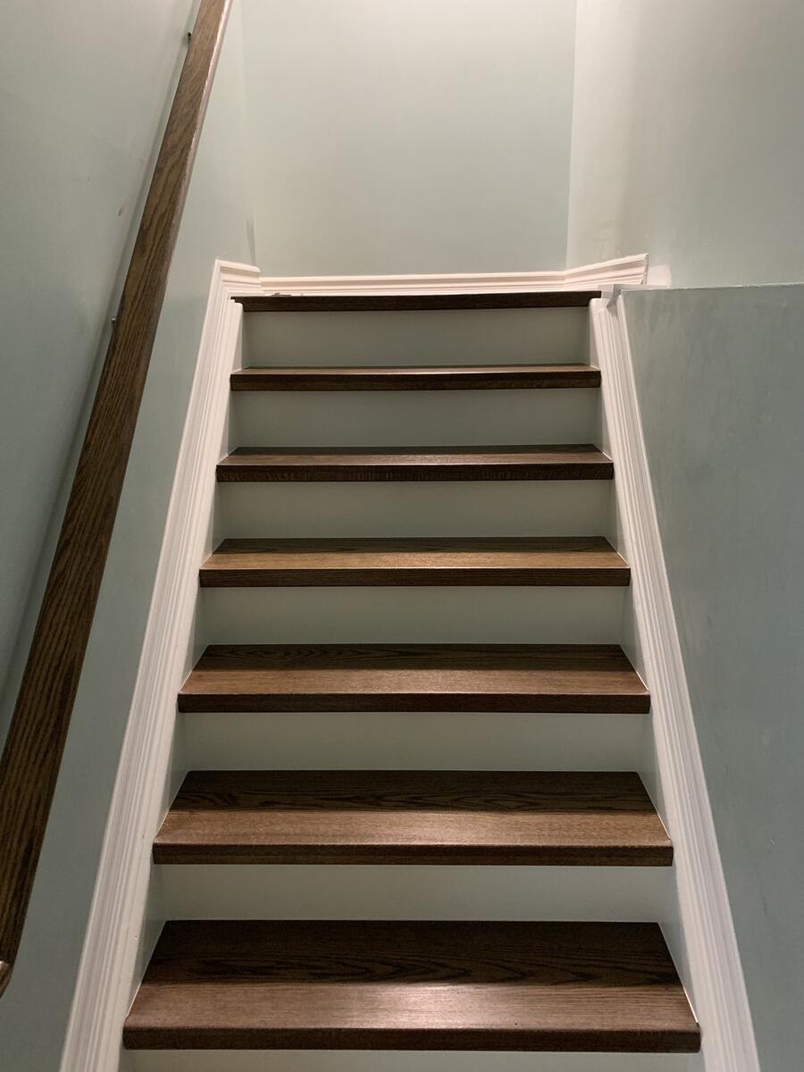 Custom hardwood staircase with wooden railings