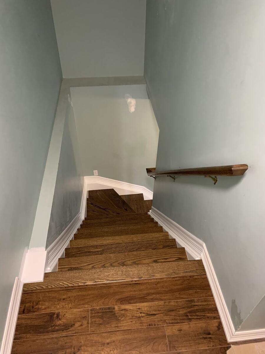 Custom hardwood staircase with wooden railings