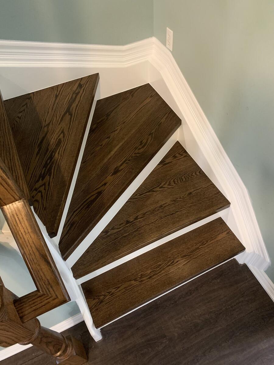 Custom hardwood staircase with wooden railings