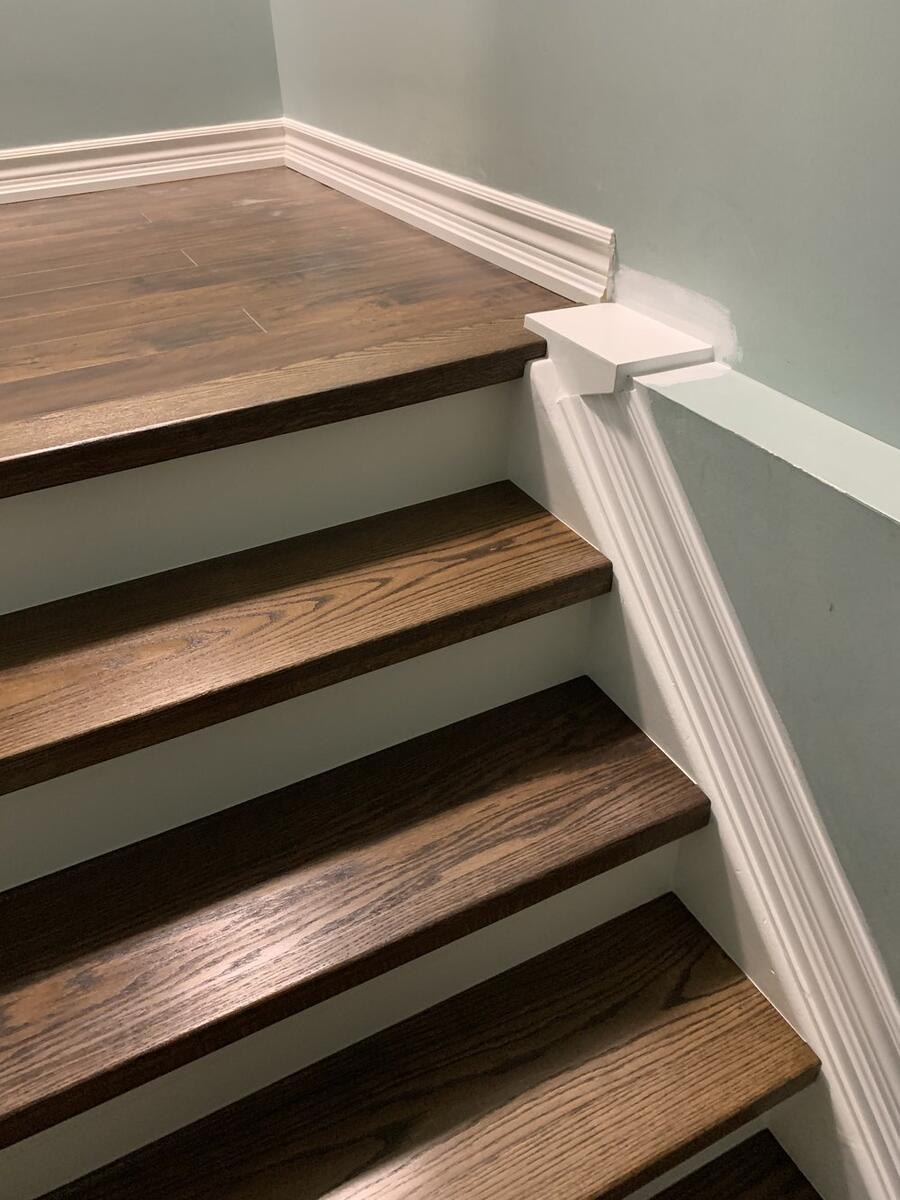 Custom hardwood staircase with wooden railings