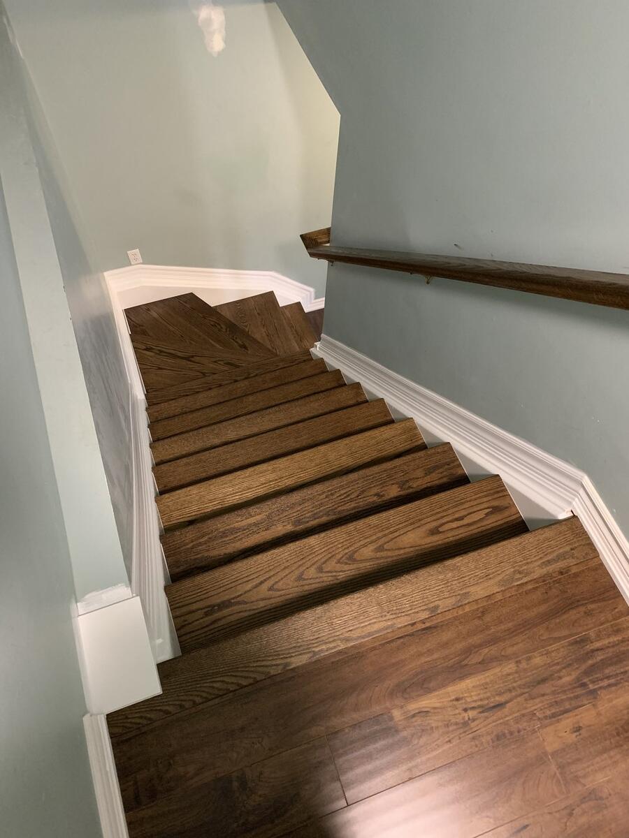 Custom hardwood staircase with wooden railings