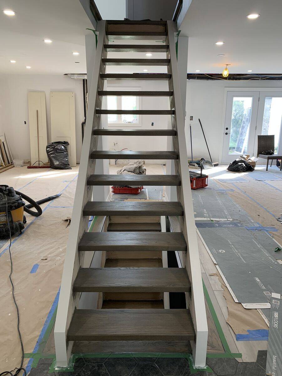 Custom hardwood staircase with wooden railings