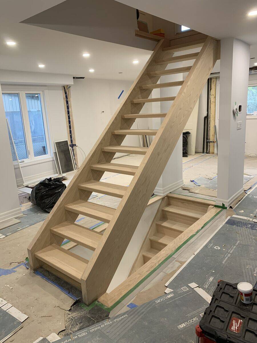 Custom hardwood staircase with wooden railings