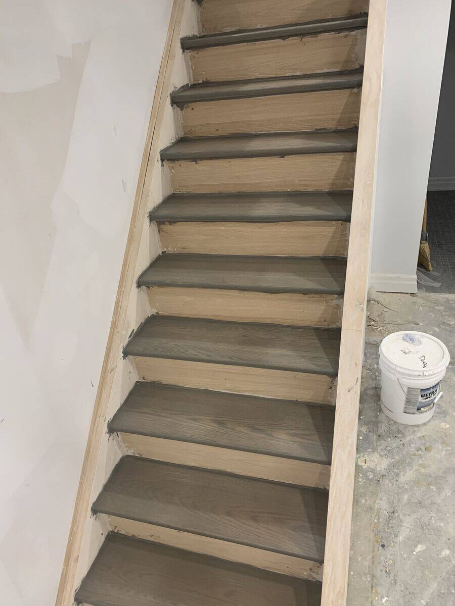 Custom hardwood staircase with wooden railings