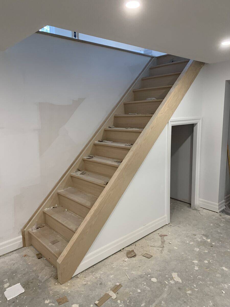 Custom hardwood staircase with wooden railings